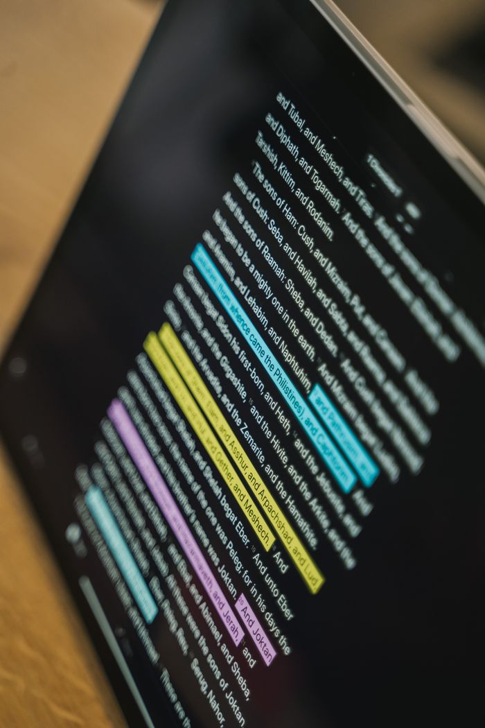 about-us Close-up of a tablet with highlighted text, showcasing digital reading.